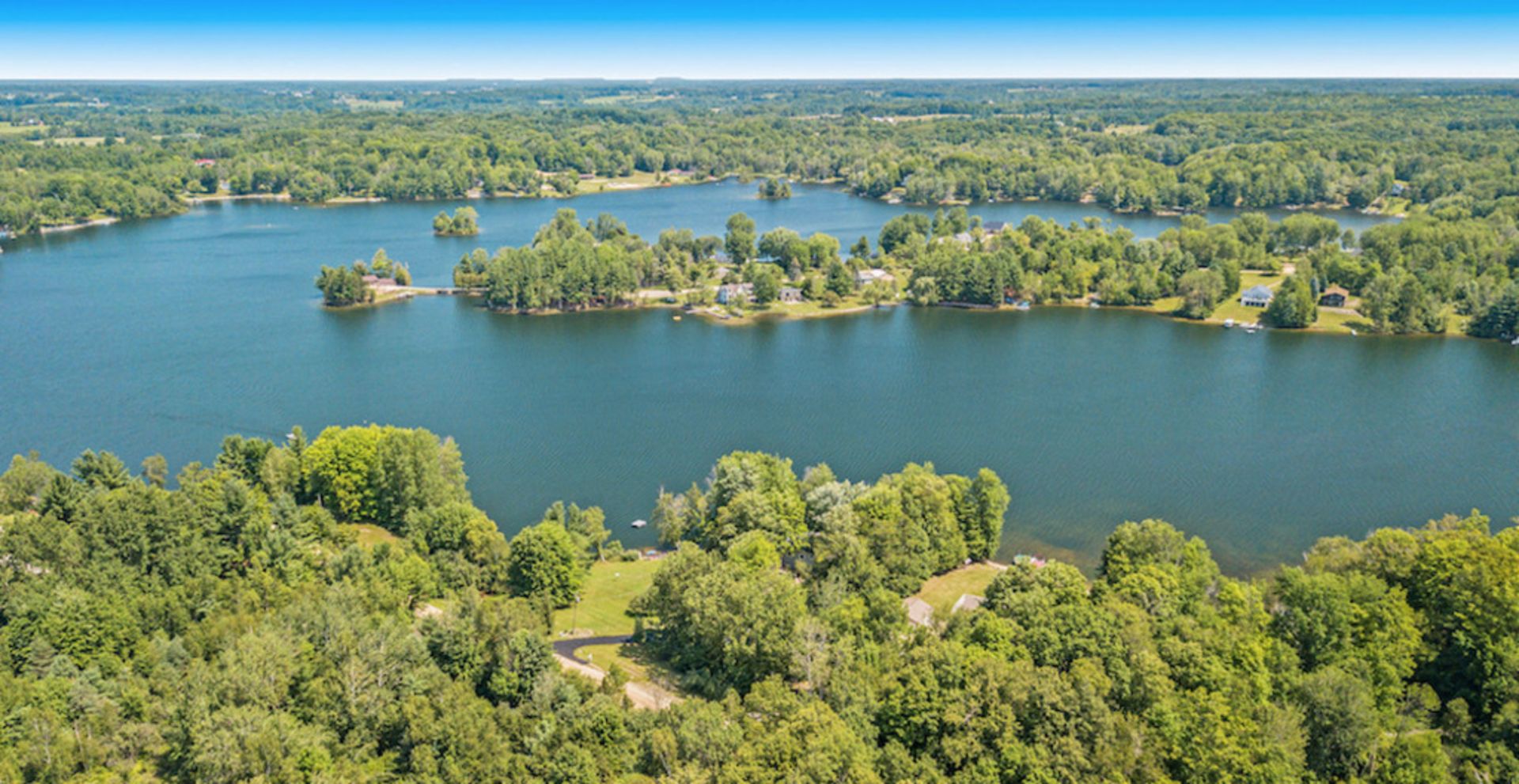 Beautiful Corner Homesite with Lake Views in Michigan's Lake Miramichi Community! - Image 2 of 14