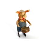 Schuco Tanzfigur Schweinchen mit Trommel, Uhrwerk def., Alterungsspuren, tw fleckig, H 12, Z 3