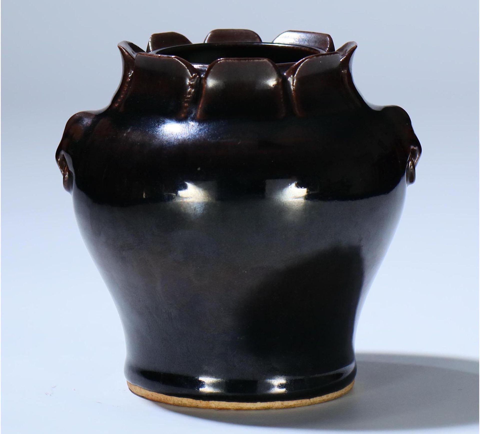 A small black-glazed jar