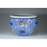 A blue and white underglaze red scroll jar decorated with lions and flowers, probably from Qing