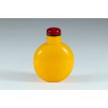 A 19th or 20th century yellow Peking glass snuff bottle