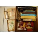 A collection of items to include hardback books based on antiques, currency, stamps, framed tapestry