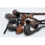A collection of vintage smoking pipes and similar of varying forms to include makes such as Carey,