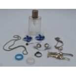 A collection of items to include silver topped scent bottle, silver chains, gold plated hunting