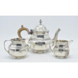 Hallmarked silver 3-piece teaset to include teapot, cream and sugar with masonic crest and wooden