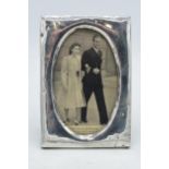 Silver photo frame, Sheffield 1919, with The Royal Betrothal postcard, 16cm tall. Some dents /