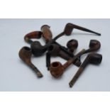 A collection of vintage smoking pipes and similar of varying forms to include makes such as