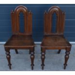 Victorian pair of oak Gothic Revival hall chairs, 87cm tall (2). In good functional condition,