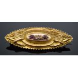 9ct gold mourning brooch set with a diamond and rubies, with steel pin and section to rear, 3.1