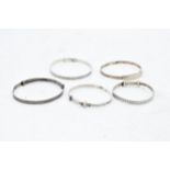 A collection of silver wrist bangles of varying sizes, 23.4 grams (5).