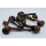 A collection of vintage smoking pipes and similar of varying forms to include makes such as Golden