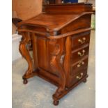 Quality 20th century Victorian-style reproduction Davenport desk with carved legs and sets of