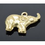 9ct gold charm of an elephant, 0.6 grams, 1cm tall.