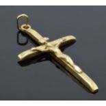 9ct gold crucifix pendant marked 'INRI', 0.7 grams, 4cm long.