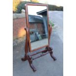 Victorian mahogany cheval rounded mirror with scrolled side supports, 152cm tall, 85cm wide.
