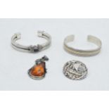 Silver jewellery to include 2 bangles, a Scandinavian ship brooch and an amber-set pendant in silver