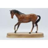 Beswick Spirit of Youth in gloss brown on ceramic base. In good condition with no obvious damage