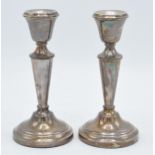 A pair of hallmarked silver candlesticks, 14.5cm tall, Birmingham 1972 (2). Good condition with some