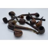 A collection of vintage smoking pipes and similar of varying forms to include makes such as Well