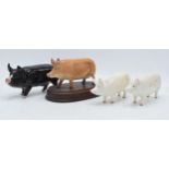 Beswick pigs to include a Berkshire Boar 4118, Tamworth pig G215 and Champion Wall Queen together