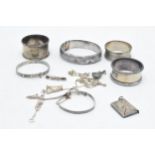 A collection of hallmarked / sterling silver to include napkin rings, chains, a stamp case and other