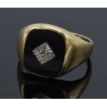 9ct gold gentleman's ring set with onyx and a diamond chip, 4.0 grams, size Q.