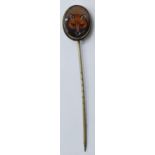 Antique Fox Head enamalled stick pin, 7cm long. Base metal. Two minor dents to top rim.