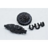 A trio of Whitby Jet brooches to include a horseshoe example, a bar brooch and a circular brooch (