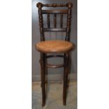 Victorian child's tall cane-seated chair, 91cm tall.