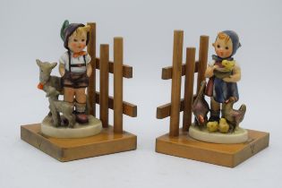 A pair of Goebel / Hummel bookends on wooden bases to include Little Goat Herder No.250 and