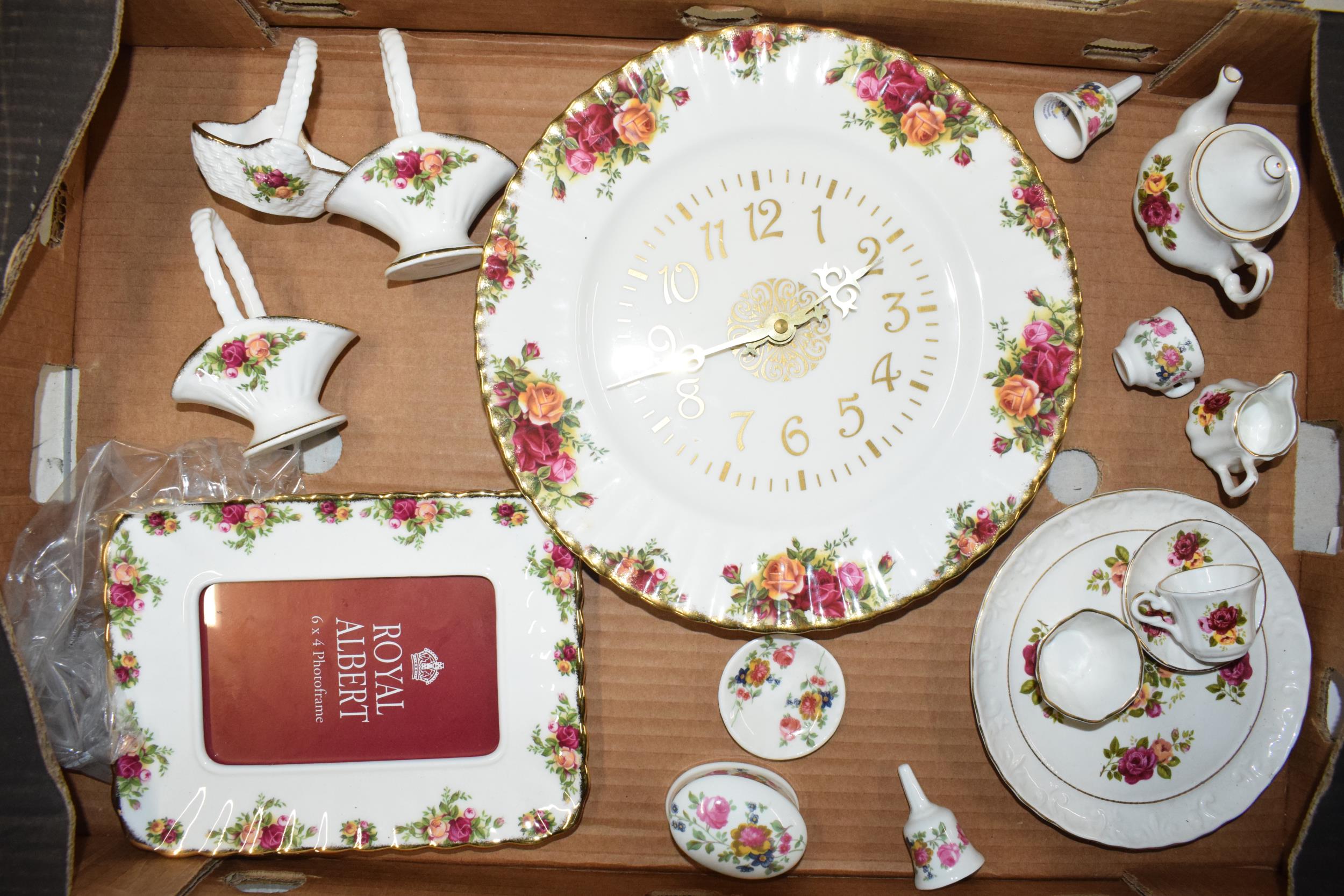 Royal Albert Old Country Roses and similar pottery to include a wall clock, posie baskets and others