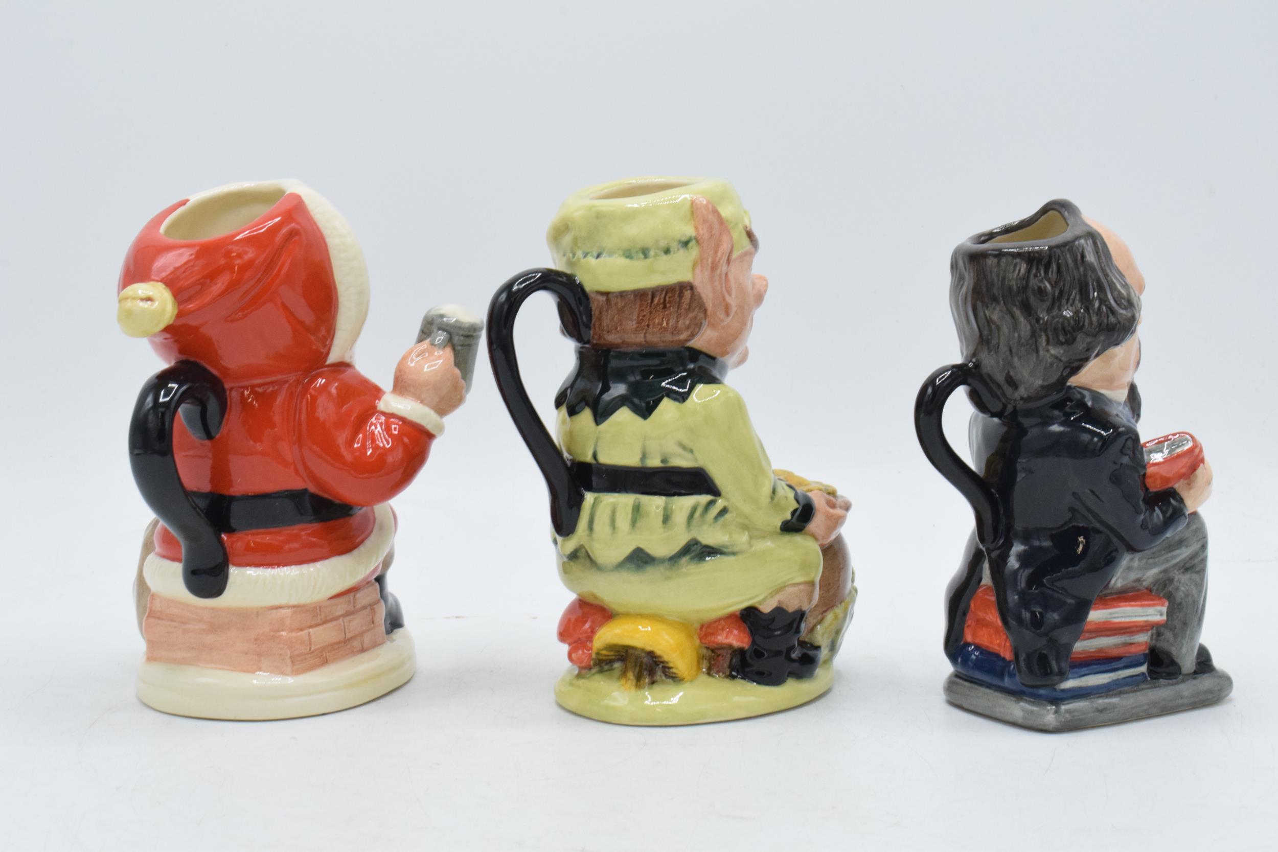 A trio of Royal Doulton Toby jugs to include Charles Dickens D6997, Leprechaun D6948 and Father - Image 2 of 5