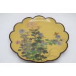 Large Japanese cloissonne shaped-edge charger with floral design on mustard yellow background,