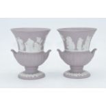 A pair of Wedgwood lilac Jasperware urns, 9cm tall. In good condition with no obvious damage or