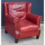 Red leather chesterfield-style leather high-backed arm chair with beaded design, 90x90x97cm tall. In
