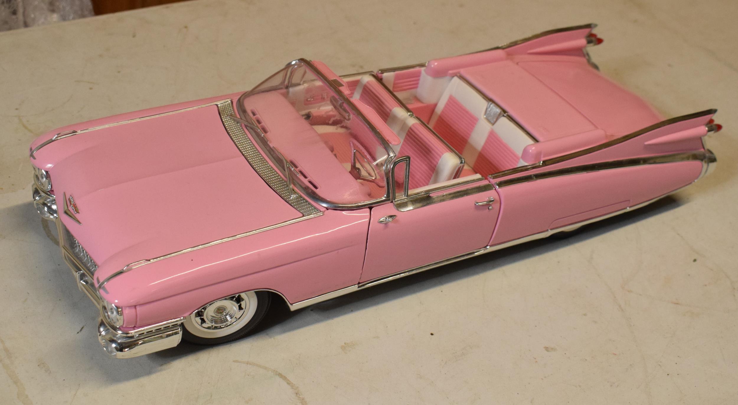Maisto 1:12 scale Cadillac Eldorado Biarritz 1959 model in pink.