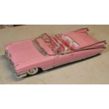 Maisto 1:12 scale Cadillac Eldorado Biarritz 1959 model in pink.