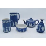 19th century and later Wedgwood Jasperware in dip / dark blue: to include a teapot, water jugs, a