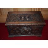 19th century oak coffer / cellaret with deeply carved fruit decoration, with lift-up lid,