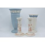 Wedgwood Queensware to include white on blue trumpet vase, 29cm tall, blue on white trumpet vase (