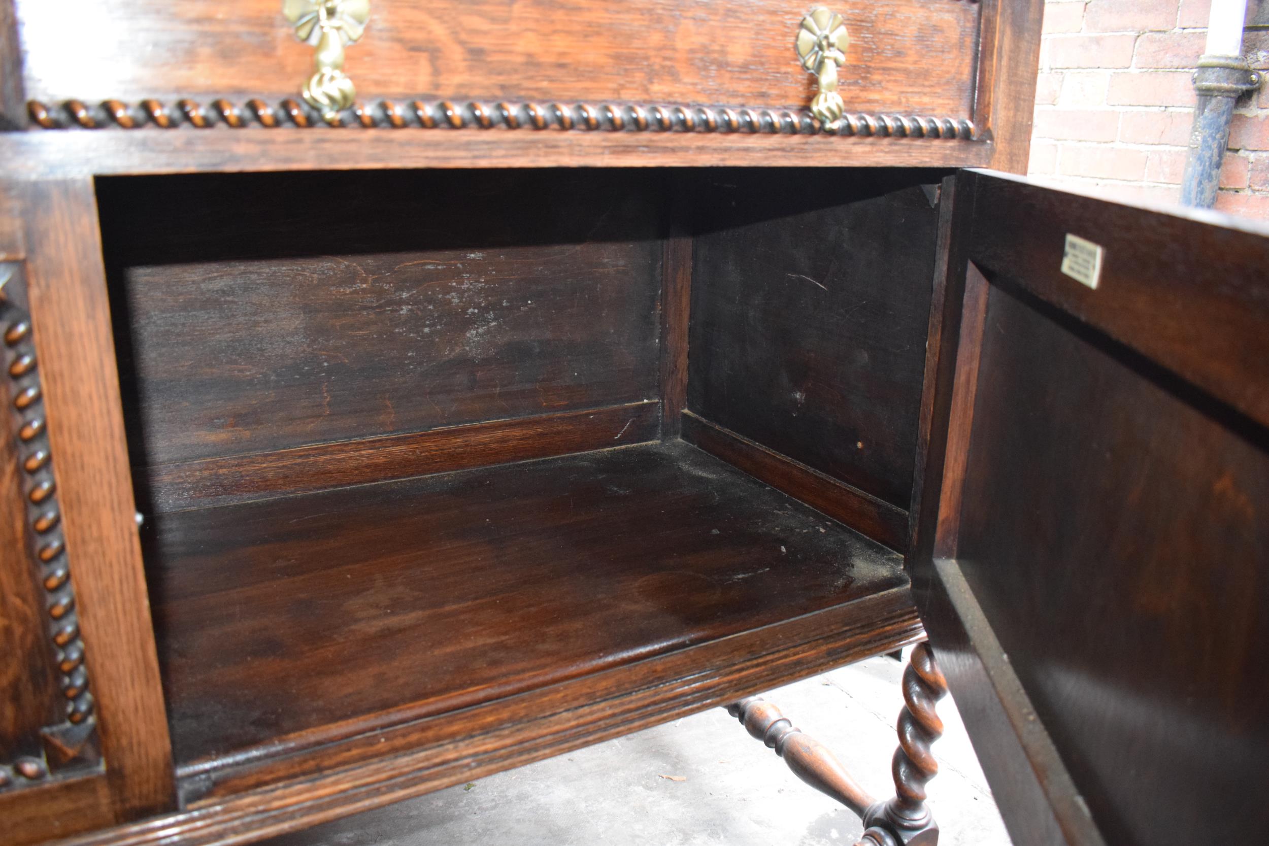 1930s oak sideboard with carved decoration with drawers and cupboards, 153x51x107cm tall. In good - Image 5 of 9