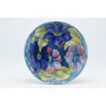 Moorcroft Hibiscus charger / plate on blue background, 26cm diameter. In good condition with no