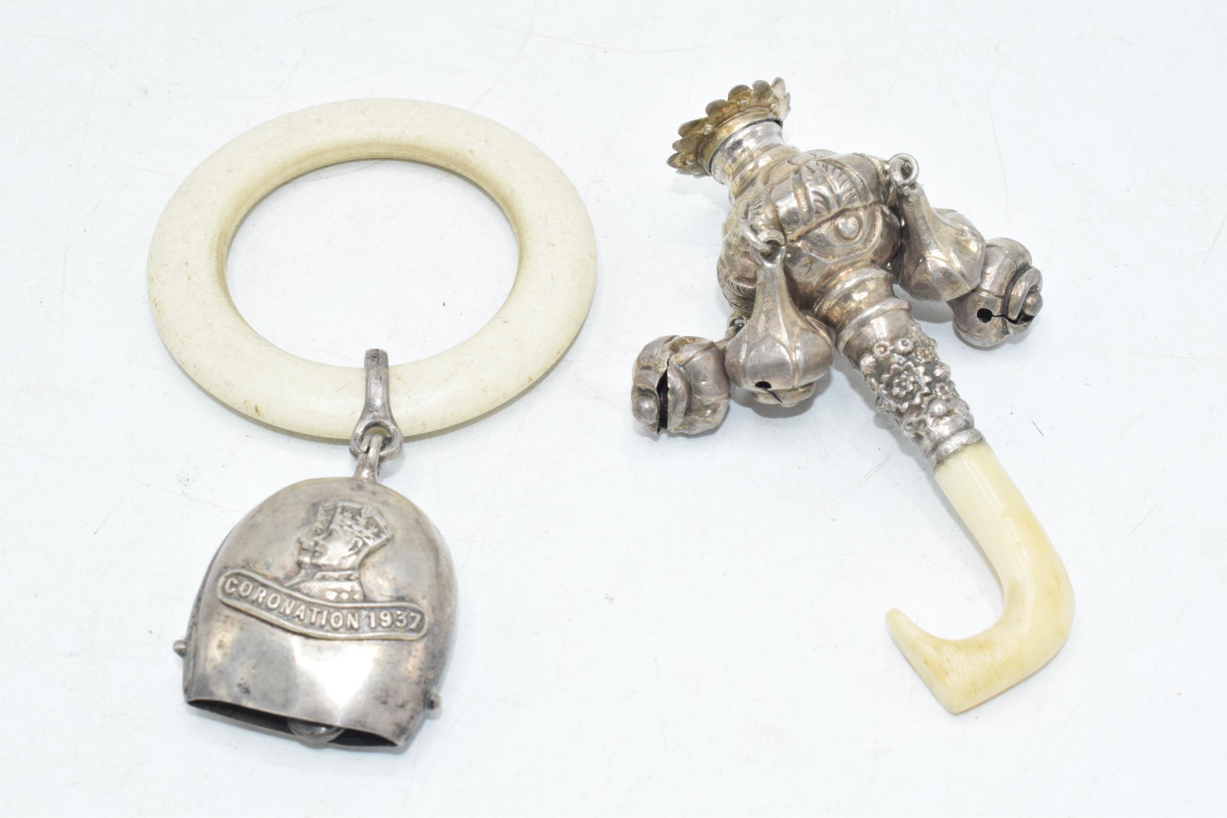 Hallmarked silver baby bell with teething ring together with a silver (marked 925) baby rattle