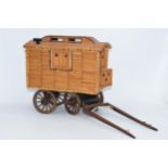 Vintage matchstick model of a gypsy caravan, 26cm long exc stretchers.