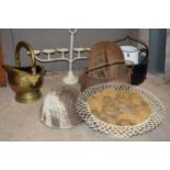 A collection of metalware to include large cast iron cooking pots, an enamel jug, vintage helmet,
