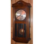 1930s oak cased wall clock with swinging pendulum, 78cm tall, with key, untested. In good functional
