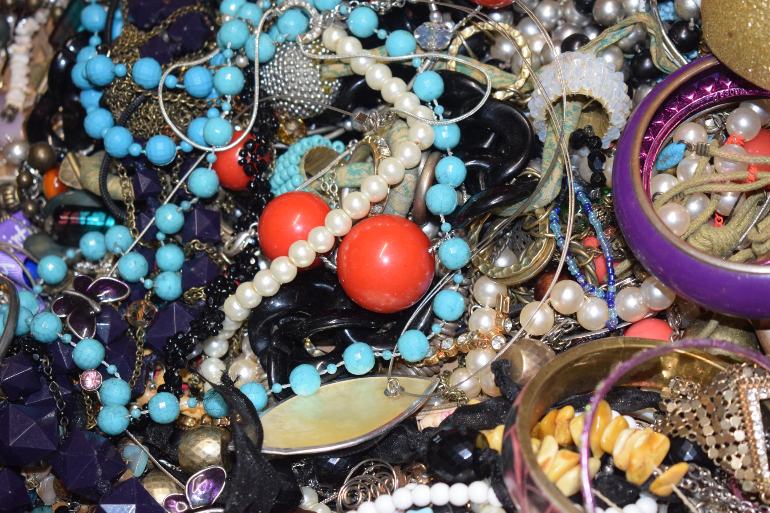 A large and varied collection of costume jewellery to include bangles, bracelets, necklaces, chain