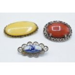 A pair of agate-style framed brooches together with a Delft brooch (3).