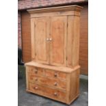 Antique pine housekeeper's cupboard with upper unit having doors with arched panel and white ceramic