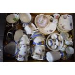 A collection of tea ware in floral patterns to include a Royal Crown Derby Derby Posies jug,